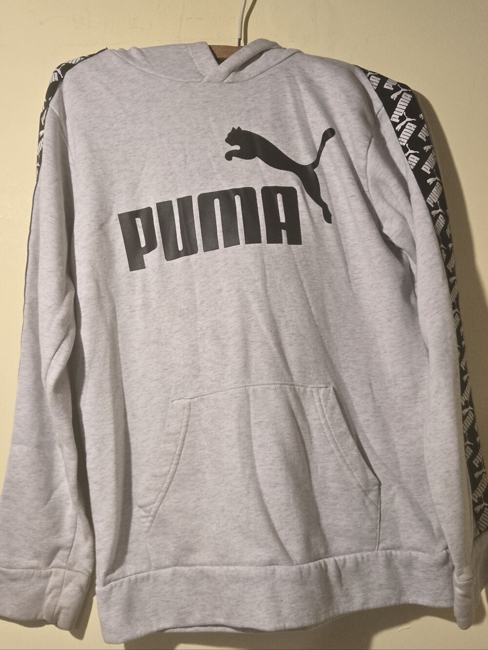 Women's Puma Light Gray Logo Pullover Hoodie with Black Accent.